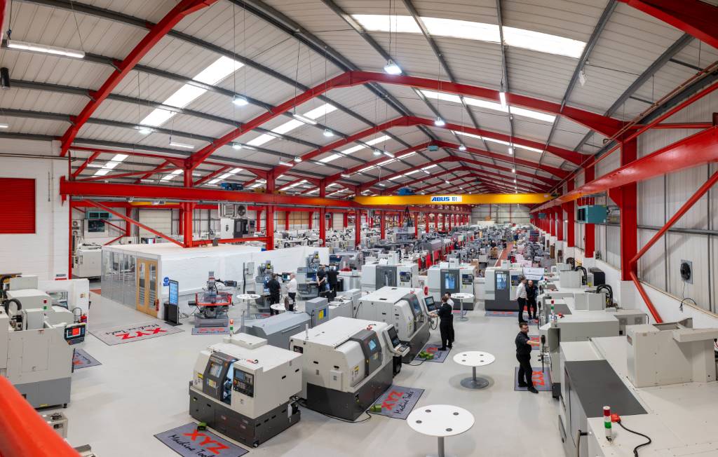The vast manufacturing area at XYZ Machine Tools